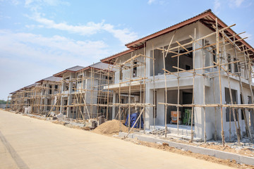 house under construction with autoclaved aerated concrete block structure at building site