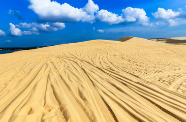 White Sand Dunes with white cloudy and blue sky