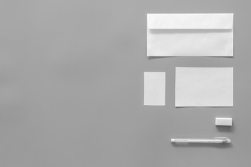 Mockup template for branding identity. White stationery on grey background top view copy space. Pattern