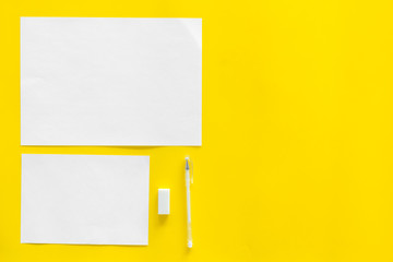 Blank stationery for branding on yellow background top view mockup pattern space for text