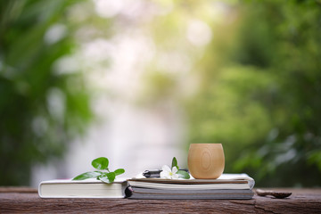 Brown vintage cup with books at outdoor