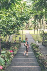 European woman in balinese temple. Bali island.