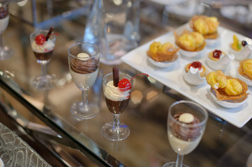 Glass shots pastry, wedding catering food, mini canapes food, tasty dessert, Beautiful decorate catering banquet table,  snacks and appetizers, wedding celebration