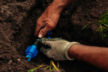 Underground garden watering system installation