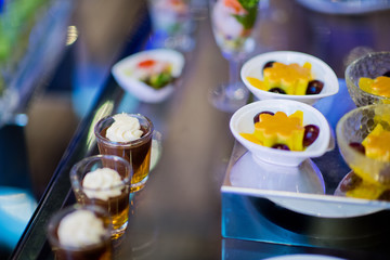 Glass shots pastry, wedding catering food, mini canapes food, tasty dessert, Beautiful decorate catering banquet table,  snacks and appetizers, wedding celebration
