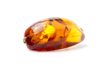 Amber brooch isolated on white background.