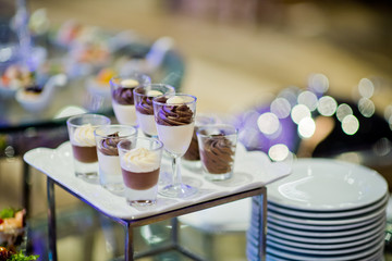 Glass shots pastry, wedding catering food, mini canapes food, tasty dessert, Beautiful decorate catering banquet table,  snacks and appetizers, wedding celebration