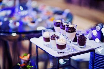 Glass shots pastry, wedding catering food, mini canapes food, tasty dessert, Beautiful decorate catering banquet table,  snacks and appetizers, wedding celebration