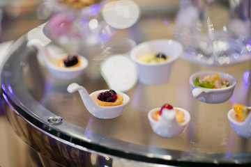 Glass shots pastry, wedding catering food, mini canapes food, tasty dessert, Beautiful decorate catering banquet table,  snacks and appetizers, wedding celebration
