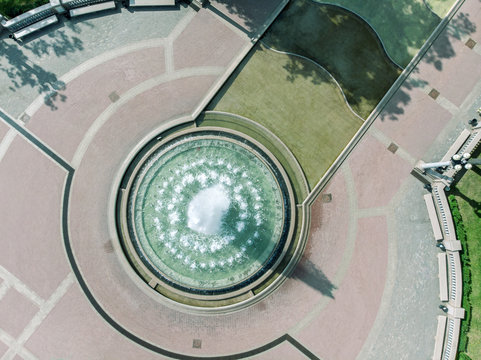 aerial drone bird's eye view photo of fountain in city park