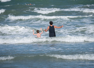 unknown father and son have fun on vacation