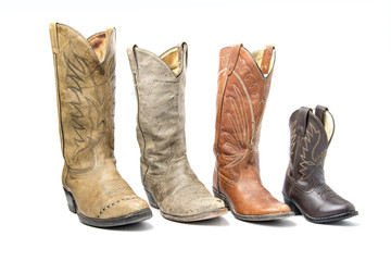 Brown cowboy boots isolated on a white background.