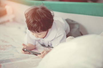 chinese child addicted phone, asian girl playing smartphone, kid use telephone, watching smartphone, watching cartoon
