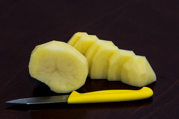 Peeled potato cutted on the small slices