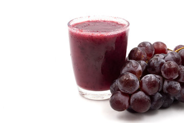 Glass of Grape juice smoothie on white background