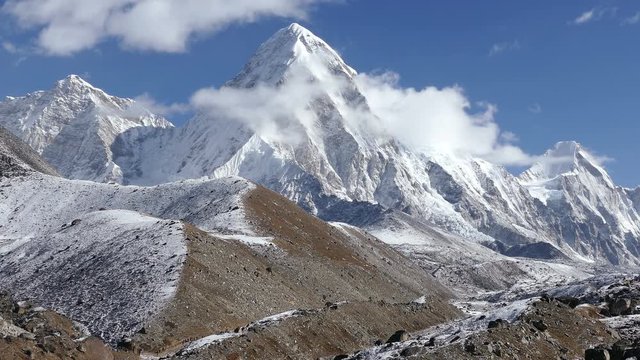 Activity, recreation: a group of tourists has a trekking towards the base camp of Everest peak (8848 m). Time lapse.