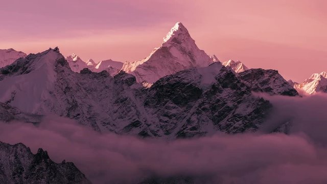 Greatness of nature: grandiose view of Ama Dablam peak (6812 m) at sunset. Nepal, Himalayan mountains. Time lapse panorama.