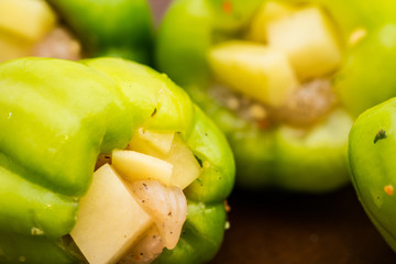 Green paprica filled by potatos and chicken breast pieces
