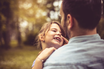 Father and daughter at park.