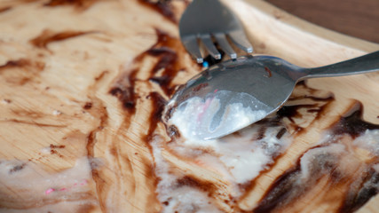 Empty wood dish and spoon after eat.