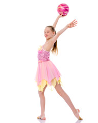 little girl is engaged in fitness with a ball.