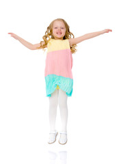 Little girl is jumping.