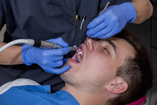 Young Man At The Dentist, To Perform A Dental Implant