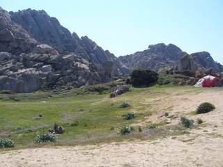 Nylon tent erected for camping vacation in isolated meadow, Sardinia, Italy