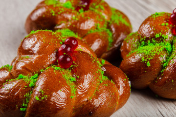 Ruddy fresh beautiful buns on a wooden background.