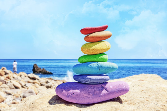 Rainbow Rock Stack by the ocean on a sunny day