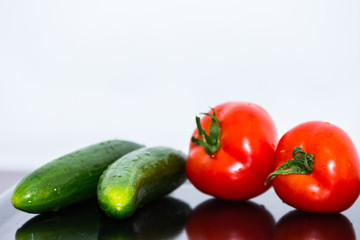Tomatoes and cucumbers on the kitchen table
