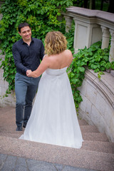 Romantic tenderness bride and groom at park. Young lady plus size enjoying moments in summer time. Beautiful bride posing with groom in her wedding day, pretty girl in a wedding dress 