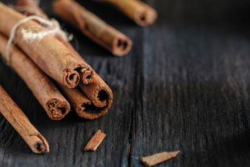 a cinnamon is spicy fragrant on a table with a mestome for a background