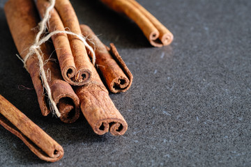 a cinnamon is spicy fragrant on a table with a mestome for a background
