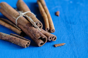 a cinnamon is spicy fragrant on a table with a mestome for a background