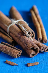 a cinnamon is spicy fragrant on a table with a mestome for a background