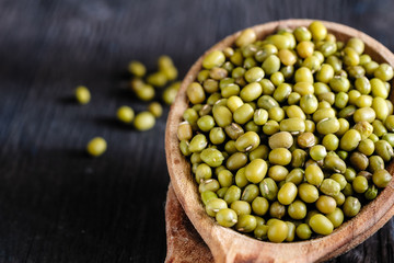 dry mung bean in ceramic bowl on wooden table