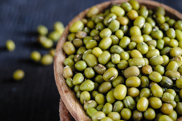 dry mung bean in ceramic bowl on wooden table