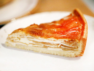 Macro photo of bright delicious piece of dessert Apple pie