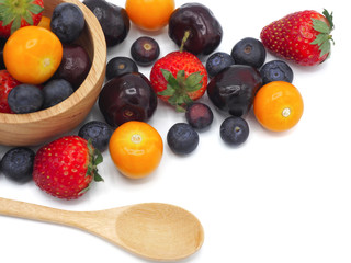 Fresh summer fruits, Cherry, strawberry, cape gooseberry and blueberry in wooden plate isolated on white background.