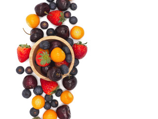 Fresh summer fruits, Cherry, strawberry, cape gooseberry and blueberry in wooden plate isolated on white background.