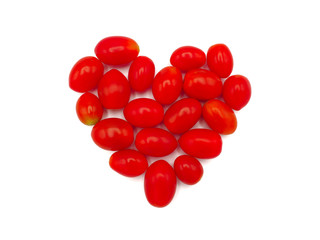 Fresh grape or cherry tomato on white background.
