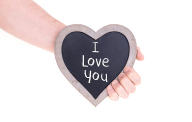 Obraz premium Adult holding heart shaped chalkboard