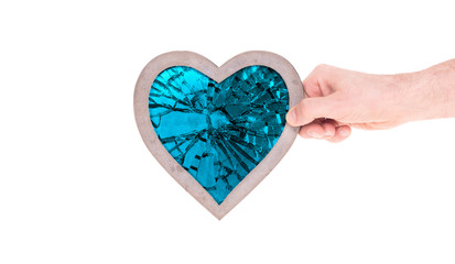 Adult holding heart filled with a large blue ruby