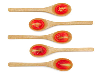 Fresh grape or cherry tomato with wooden spoon on white background.