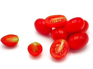 Fresh grape or cherry tomato on white background.