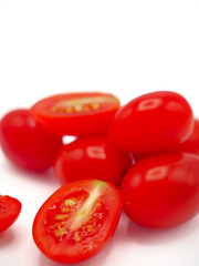 Fresh grape or cherry tomato on white background.