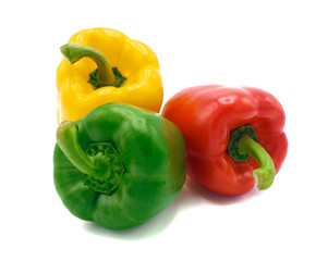 Fresh vegetables, red, yellow, green sweet peppers on white background.