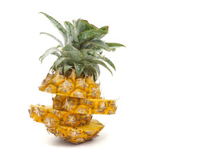 Fresh pineapple fruit with slices on white background