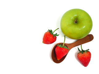 Stethoscope, fresh green apple and strawberry on white background. Healthy food and lifestyle concept.